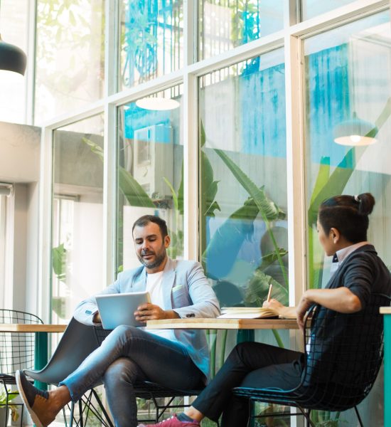 confident-multiethnic-colleagues-having-informal-meeting-cafe_1262-16963