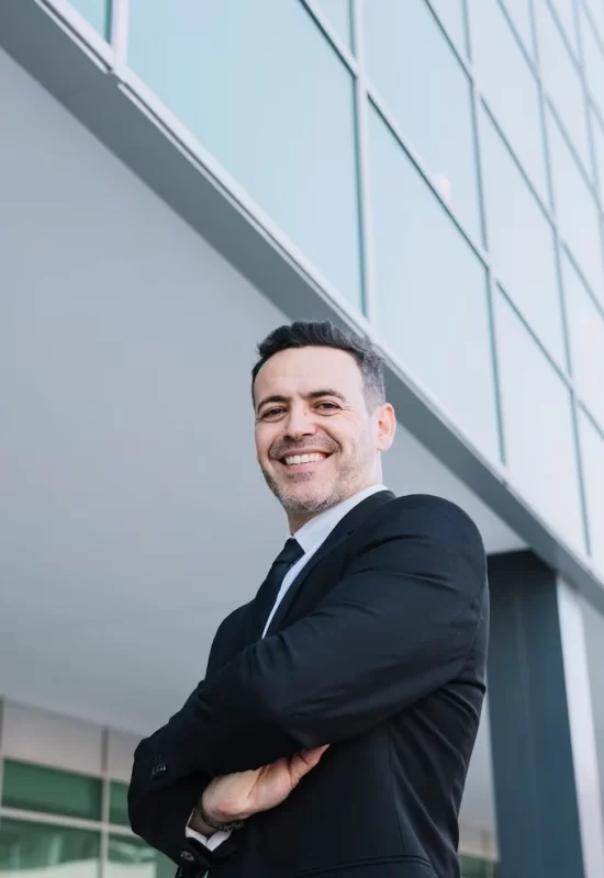 friendly-businessman-with-arms-crossed_23-2147710250